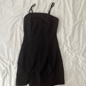 Black tight club dress, with slit at bottom